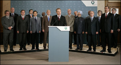 President George W. Bush stands with fellow G8 leaders as Britain’s Prime Minister Tony Blair issues a brief statement from Gleneagles Hotel in Auchterarder, Scotland, regarding the terrorist attacks Thursday, July 7, 2005, in London. Shortly after the statement, Prime Minister Blair departed the hotel to return to London for a security briefing.