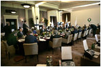 G8 leaders gather around the table for a morning session at the Gleneagles Hotel in Auchterarder, Scotland.  The summit ended Friday, July 8, 2005.