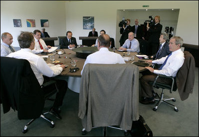 President George W. Bush sits with G8 leaders Thursday, July 7, 2005, during their first session at Gleneagles Hotel in Auchterarder, Scotland. Clockwise, from the President, are: French President Jacque Chirac; Prime Minister Tony Blair of Britain; Russian President Vladimir Putin; Germany’s Chancellor Gerhard Schroeder; Italian Prime Minister Silvio Berlusconi; European Commission President Jose Manuel Barroso; Canada's Prime Minister Paul Martin, and Japan's Prime Minister Junichiro Koizumi.