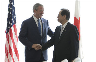 President George W. Bush and Japan's Prime Minister Yasuo Fukuda shake hands at their first meeting Sunday, July 6, 2008, at the Windsor Hotel Toya Resort and Spa in Toyako, Japan, site for this year's 2008 Group of Eight Summit.