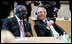 President George W. Bush shares a moment with President John Agyekum Kufuor of Ghana prior to the start Monday, July 7, 2008, of the G8 Working Session with Africa Outreach Representatives in Toyako, Japan.