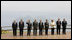 With Lake Toya as a backdrop, leaders of the Group of Eight pose for the official family photograph Tuesday, July 8, 2008, in Toyako, Japan.