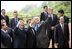 President George W. Bush joins President Nicolas Sarkozy of France, and Jose Manuel Barroso, President of the European Union, as they wave to hotel staff Tuesday, July 8, 2008, following the G-8 family portrait at the Windsor Hotel Toya Resort and Spa. Looking on are Italy’s Prime Minister Silvio Berlusconi, lower left, President Dmitriy Medvedev of Russia, left, and Prime Minister Yasuo Fukuda of Japan, right, host of the 2008 Summit.