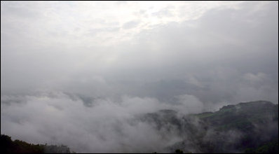 Lake Toya is barely visible through the early morning fog Tuesday, July 8, 2008. The volcanic caldera lake in Shikotsu-Toya National Park on Hokkaido, Japan is part of the scenic setting for the 2008 G-8 Summit.