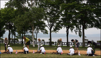 Mrs. Laura Bush, joined by other G-8 spouses, plants a tree at the Toyako New Mount Showa Memorial Park during tree planting ceremony Wednesday, July 9, 2008, in Hokkaido, Japan. Joining Mrs. Bush from left are Mrs. Sarah Brown, spouse of the Prime Minister of the United Kingdom, Mrs. Svetlana Medvedev, spouse of the President of Russia, Mrs. Laureen Harper, spouse of the Prime Minister of Canada, Mrs. Kiyoko Fukuda, spouse of the Prime Minister of Japan, and Ms. Harumi Takahashi, Governor of Hokkaido.