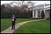 White House Chief of Staff Andy Card watches President George W. Bush depart from the South Lawn April 12, 2001 