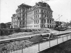 Photo showing the construction of the South and East wings of the EEOB, 1874 (NARA)