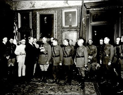 Secretary of War Dwight Davis decorating the "Round the World Flyers" on September 5, 1924. These eight Americans in four planes were the first to successfully fly around the world beating five other countries at this quest.