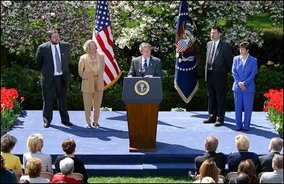 President George W. Bush discusses the economy in the Rose Garden Tuesday, April 15, 2003. Accompanying President Bush on stage are, from left, small business owners Tim Barrett, Christine Bierman, Frank Fillmore and Karla Aaron.