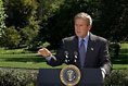 President George W. Bush discusses his Clear Skies Initiative in the East Garden Tuesday, Sept. 16, 2003. The initiative mandates a 70 percent cut in air pollution from power plants over the next 15 years, including the first-ever national cap on mercury emissions. 