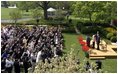 President George W. Bush and First Lady Mrs. Laura Bush with Kathleen Mellor the 2004 Teacher of the Year from South Kingstown, Rhode Island in the Rose Garden of the White House on April 21, 2004.