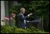 President George W. Bush welcomes the new members of Iraq's interim government during a statement in the Rose Garden Tuesday, June 1, 2004. The U.S.-led Coalition Provisional Authority will transfer sovereignty to Iraq's Interim President Sheikh Ghazi al-Yawar and Interim Prime Minister Iyad Allawi on June 30. 