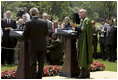 President George W. Bush and Hamid Karzai of Afghanistan hold a joint press conference in the Rose Garden Tuesday, June 15, 2004.