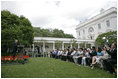 President George W. Bush addresses 200 exchange students from the program in the Rose Garden Monday, June 13, 2005. Living with host families for one year, the students come from mostly Muslim countries. "I think your generation is going to help shape one of the most exciting periods of history in the broader Middle East and the world," said the President. "It's a period of time when the hope of liberty is spreading to millions." 