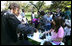 Children participate in the First Bloom activities Sunday, Oct. 19, 2008, during the Fall Garden Tour at the White House. The First Bloom event encourages kids to get involved with conserving America's National Parks.