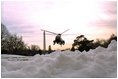 Marine One arrives from Camp David and lands on the South Lawn in an area cleared of snow, Sunday, Dec. 8, 2002.