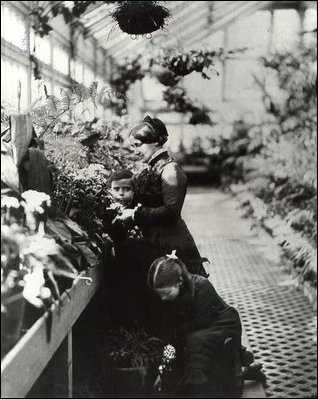 Lucy Hayes, son Scott, daughter Fannie and a friend stand in the conservatories, c.1879.