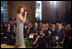 Jaci Velásquez performs during a celebration of contributions and accomplishments of Hispanic Americans in the East Room, October 9, 2002, at the White House Reception for Hispanic Heritage Month.