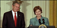 President and Mrs. Bush highlight the importance of early childhood education in an East Room event April 3, 2002. Following their remarks, PBS KIDS characters from Sesame Street, Mr. Rogers' Neighborhood and Between the Lions entertained the audience. 