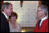 President George W. Bush greets Fred Rogers of Mister Rogers Neighborhood in the Blue Room before an early childhood education event in the East Room April 3, 2002. 