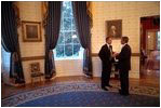 Before delivering his address to Congress and the nation following the attacks of September 11, President George W. Bush speaks with British Prime Minister Tony Blair in the Blue Room, Sept. 20, 2001. 