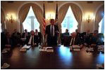 President George W. Bush meets with Vice President Richard Cheney, Secretary of Defense Donald Rumsfeld, Secretary of State Colin Powell, Chairman of the Joint Chiefs of Staff Richard Myers and the other members of the National Security Council in the Cabinet Room following the terrorist attacks, Sept. 12, 2001.