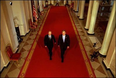 President George W. Bush and Russian President Vladimir Putin walk out to address the media at the White House on Nov. 13, 2001. "This is a new day in the long history of Russian-American relations, a day of progress and a day of hope," said President Bush in his remarks.