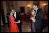 Leading their wives in the first dance of the evening, Presidents Bush and Mexican President Vicente Fox take to the floor during the state dinner held on September 5, 2001.