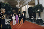 President Gerald Ford and Mrs. Ford escort Japanese Emperor Hirohito and Empress Nagako down the red carpet prior to a state dinner on October 2, 1975.