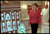 In the China Room on December 2, 2001, Laura Bush takes a sneak preview at White House Pastry Chef Roland Mesnier's gingerbread creation. Built from more than 80 pounds of gingerbread, it was a re-creation of the original White House as it appeared in 1800 when John Adams became the first resident.