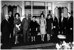 Jacqueline Kennedy gives a tour of the newly-refurbished White House Library June 21, 1962. Mrs. Kennedy also gave a televised tour for her historic redecoration of the State Floor of the White House.