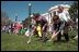 Children race to reach the finish line by rolling hard-boiled eggs across the South Lawn of the White House during the annual White House Easter Egg Roll April 1, 2002. Honoring an Easter tradition that President Rutherford B. Hayes started in 1878, President George W. Bush and Mrs. Bush opened the peoples' home to children, games and many rolling Easter eggs.