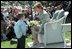 Laura Bush takes a moment for a little reader during one of the many story book hours at the annual White House Easter Egg Roll on the South Lawn of the White House April 1. Several cabinet secretaries, such as Rod Paige and Norman Mineta, gave readings. Marc Brown, who wrote the children's book 