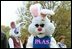 Greeting children between their activities, the Easter Bunny and friends hug and shake hands during the White House Easter Egg Roll Monday, April 21, 2003. 