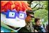 A United States Marine and her son stand for pictures with Chuckie, a character from the cartoon, "Rugrats," during the White House Easter Egg Roll Monday, April 21, 2003. More than 30 children's characters wandered through the South Lawn during the day's festivities, including Clifford the Big Red Dog, Winnie the Pooh and the Berenstain Bears. 