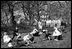 Children play with eggs on the South Lawn of the White House in 1963. The Eisenhower Executive Office Building is pictured in the background. 