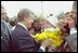 President Carter smiles as he reaches out to a young fan at the 1980 White House Easter Egg Roll.