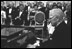 Former President Harry Truman tickles the ivories for President and Mrs. Kennedy in the East Room November 1, 1961.