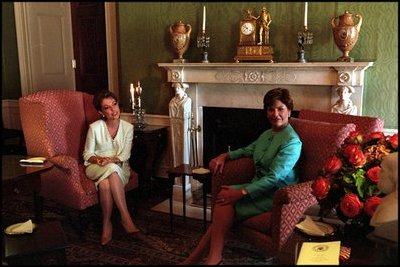 During the Mexico State Visit, Laura Bush and Marta Sahagún de Fox, wife of Mexican President Vicente Fox, enjoy a quiet moment in the Green Room Sept. 5, 2001. The Green Room has provided a cozy environment for relaxed conversation over the years.