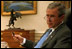 Before his address to Congress and the nation following the attacks of September 11, President George W. Bush meets with speechwriter Michael Gerson, National Security Advisor Condoleezza Rice and Counselor Karen Hughes in the Oval Office Sept. 20, 2001. 