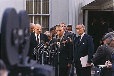 President Lyndon Johnson and General William Westmoreland speak to reporters in the "stake out" area outside the West Wing April 7, 1968.