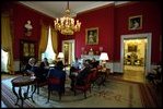 Before a performance by Eugene Kohn on the White House Steinway piano, Mrs. Bush hosts an arts discussion called an "operalogue" with guests in the Red Room April 17, 2002. The Red Room was the site of Dolley Madison's music room. Her piano and guitar and the sunflower yellow décor made the room a popular gathering place during her popular Wednesday Drawing Room parties.