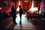 Vice President Dick Cheney and Dr. Condoleezza Rice speak in the Red Room before a press availability by the President of Pakistan Feb. 13, 2002. In contrast to the large East Room, the smaller Red Room has provided a place for quiet conversation over the years.