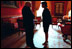 Vice President Dick Cheney and Dr. Condoleezza Rice speak in the Red Room before a press availability by the President of Pakistan Feb. 13, 2002. In contrast to the large East Room, the smaller Red Room has provided a place for quiet conversation over the years.