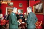 President George H.W. Bush talks with General Colin Powell, during a meeting with the Joint Chiefs of Staff in the Red Room on January 16, 1992. General Powell later served as Secretary of State during President George W. Bush's first term.