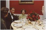 Betty Ford sits next to General Alexander Haig, future Secretary of State (1981-82) in the Red Room during a dinner held in General Haig’s honor October 23, 1974. 