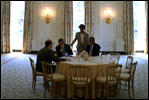 President George W. Bush meets with Chief of Staff Andy Card, National Security Adviser Condoleezza Rice and Press Secretary Ari Fleischer in the State Dining Room before a luncheon in the Blue Room May 2, 2002. Thomas Jefferson used the State Dining Room as his office.