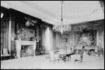 President Theodore Roosevelt's State Dining Room was baronial style and featured stuffed moose and elk heads on the walls. In contrast, the first cabinet dinner in this room on Dec. 18, 1902 featured pink roses and candles.