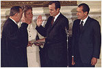 Appointed by then-President Richard Nixon, future President George H.W. Bush is sworn-in as U.S. Representative to the United Nations in the State Dining Room February 26, 1971.