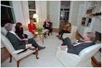 Vice President Dick Cheney and Lynne Cheney entertain Chief of Staff for the Vice President Lewis Libby (left) and his wife Harriet Grant (second on right) and former Vice President Dan Quayle (right) and his wife Marilyn Quayle (second on left) in the first floor library at the Naval Observatory Dec. 4, 2001. 